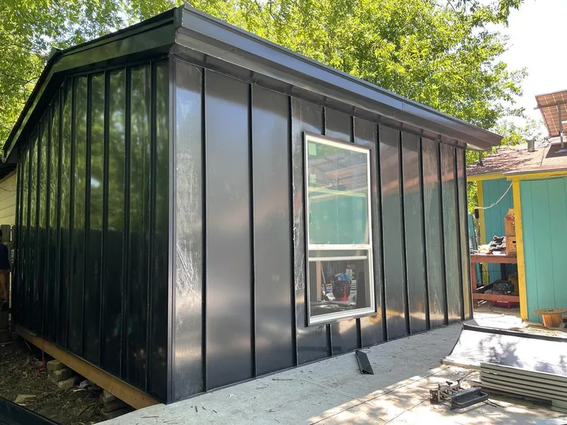 Black standing seam metal wall panels for Roof Inspection in Ellington